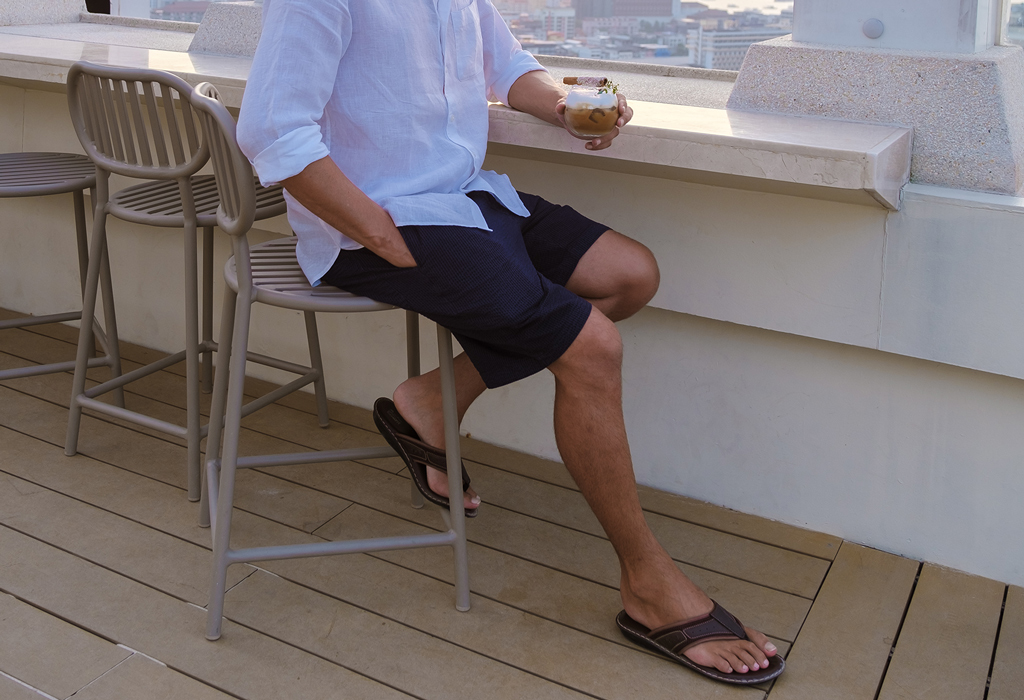 man wearing sandals and shorts