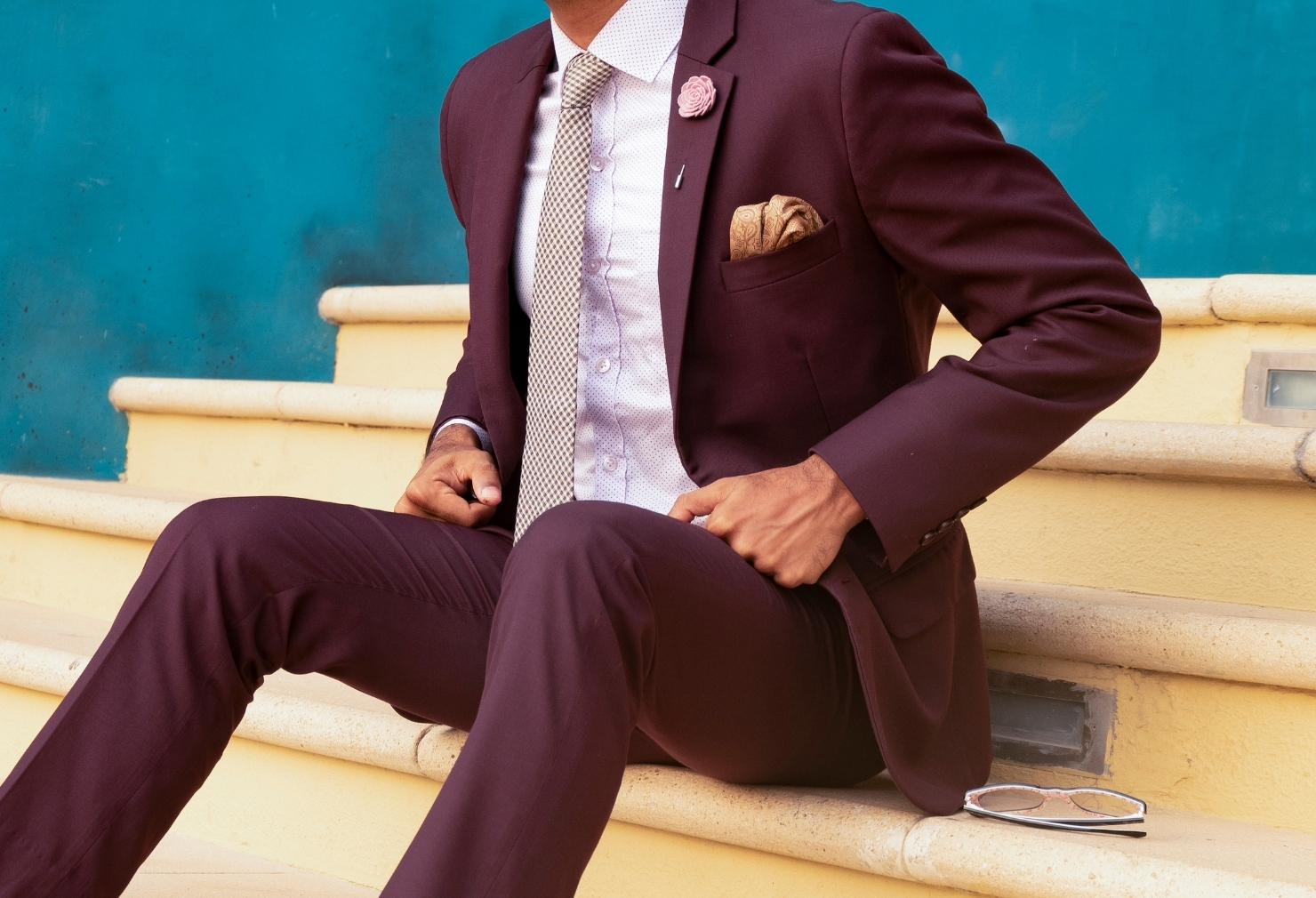 man wearing a burgundy suit